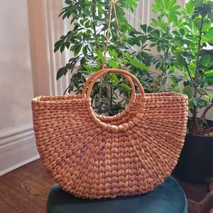 Half moon natural woven raffia bag with bamboo handles